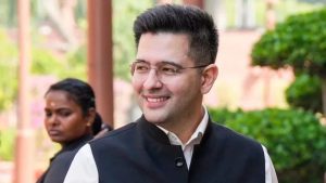 A close-up portrait of Raghav Chadha, smiling and looking off-camera against a soft-focus outdoor background. He is wearing his signature rimless glasses, a white shirt, and a black Nehru jacket. The image is titled "Raghav Chadha Quits AAP" in reference to his announcement joining the BJP.