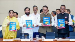 Maharashtra Chief Minister Devendra Fadnavis, Deputy Chief Ministers Eknath Shinde and Sunetra Pawar, and Transport Minister Pratap Sarnaik holding the newly launched ‘Practical Marathi’ guidebook for transport drivers during a formal event at Mantralaya.