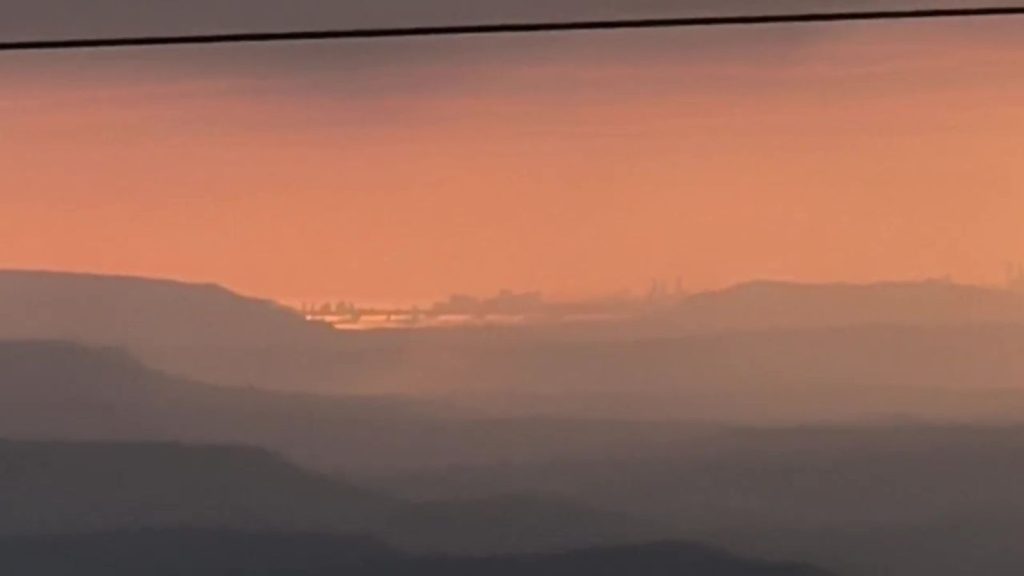 A zoomed-in screenshot captured from a video shot by a tourist in Lonavala's Shivling Point showing Mumbai's skyline being visible from such a distance after the rains cleaned the air of all pollutants and dust.