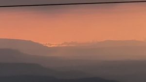A zoomed-in screenshot captured from a video shot by a tourist in Lonavala's Shivling Point showing Mumbai's skyline being visible from such a distance after the rains cleaned the air of all pollutants and dust.