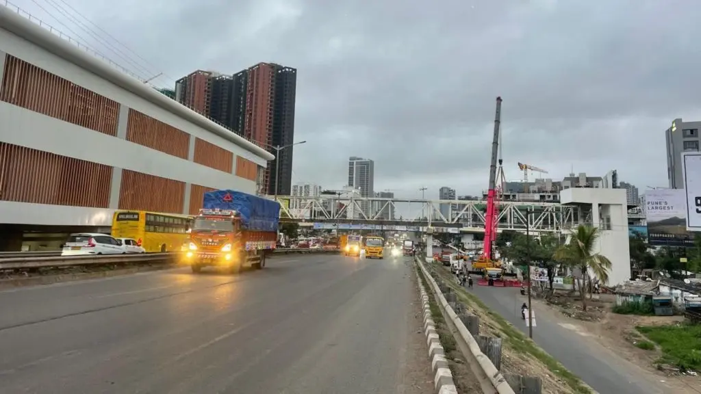 Wakad Metro Station Foot Over Bridge under construction on the Mumbai-Bengaluru Highway to improve pedestrian access and connectivity for Pune Metro Line 3 in Wakad, Pune.
