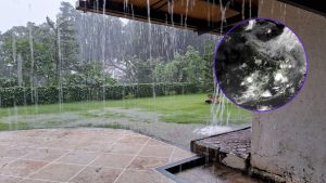 Heavy monsoon rain pours from the roof of a house onto a flooded lawn and patio, with waterlogging visible across the grass and surrounding greenery. An inset satellite weather image on the right shows dense cloud cover and active rain-bearing systems over large parts of India, highlighting the widespread monsoon activity. The composite image illustrates the intense rainfall affecting Pune and the Western Ghats region, where locations such as Bhira and Tamhini recorded very heavy rain during the last 24 hours.