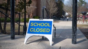 A placard showing school closed.
